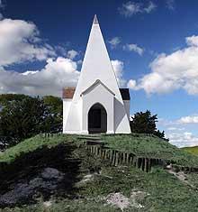 This attractive white pyramid on Farley Mount commemorates a horse