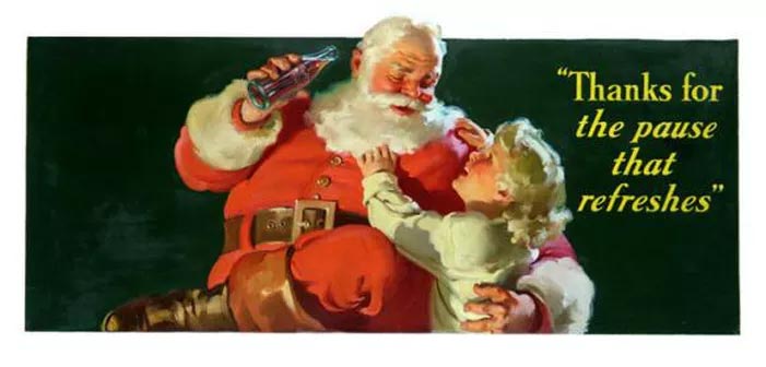 Santa Claus sups a Coca-Cola