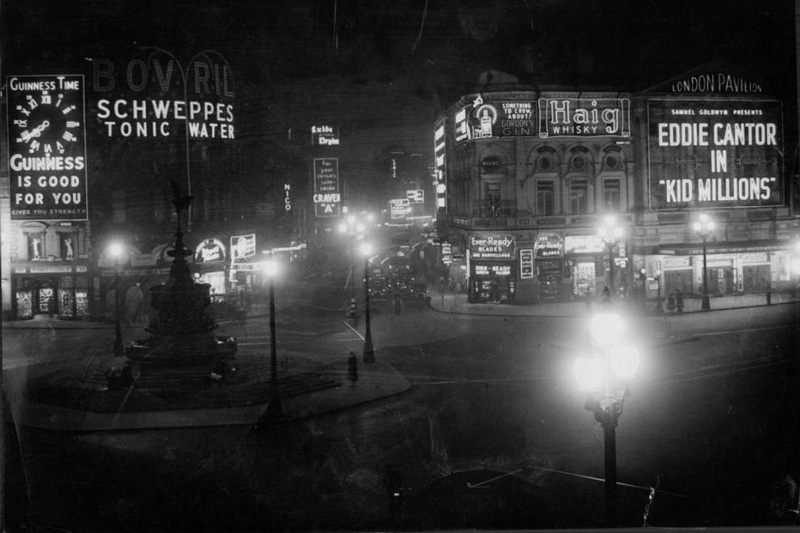 Early lights at Piccadilly Circus with incandescent bulbs