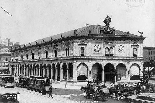 The New York Herald Building, decorated with the statue of Minerva and its many owls